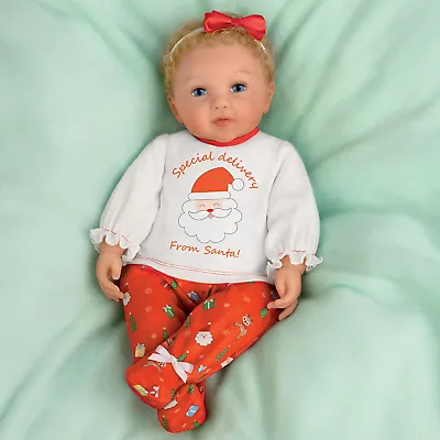 The Ashton - Drake Galleries Mommy's Girl Holiday Edition Baby Doll With 2 Outfits Lifelike & Poseable RealTouch® Vinyl Skin, Hand Rooted Hair & Cuddly Beanbag Body Girl Doll by Ping Lau 17-inches