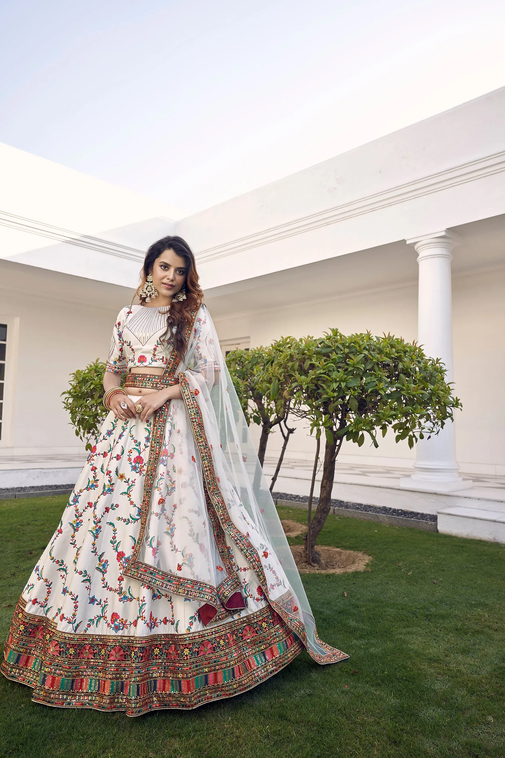 White Silk Embroidered Bridal Reception Heavy Border Lehenga Choli